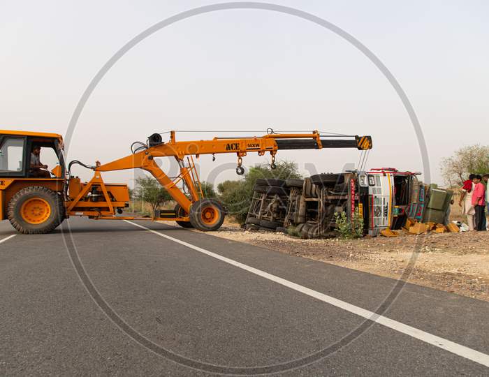 crashed Truck lies on the road after incident.