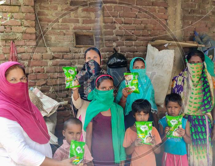 Patna, Bihar - 24 August 2020: milk distribution among poor people