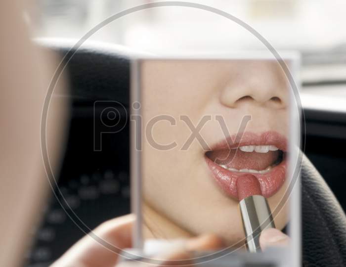 Lipstick face in mirror