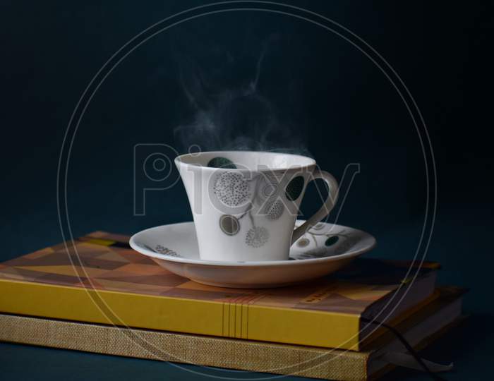 Steaming Coffee cup on diary