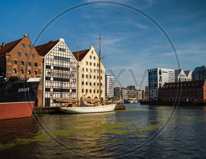 Gdansk, North Poland - August 13, 2020: Wide Angle Shot Of Summer Around Motlawa River Adjacent To Beautiful European Architecture Near Baltic Sea