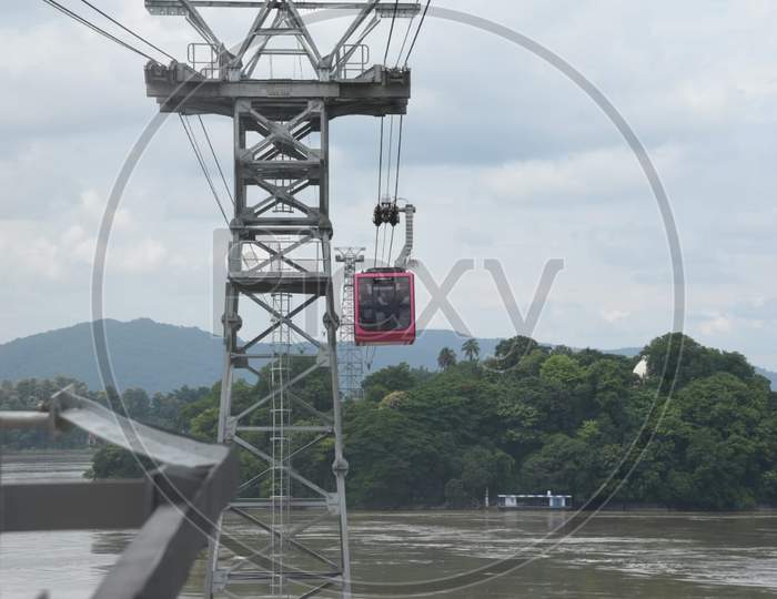 People Travel In Cable Car Cabins In India'S Longest River Ropeway Over The River Brahmaputra, In Guwahati On August 24, 2020.