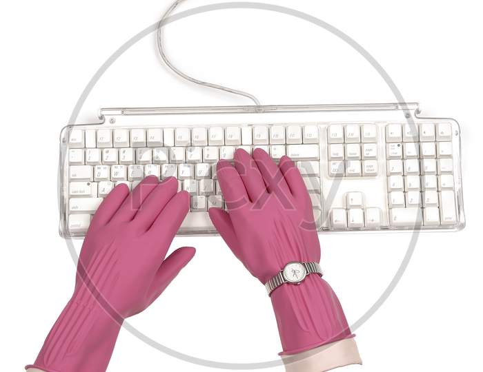 Keyboard typing with pink gloves