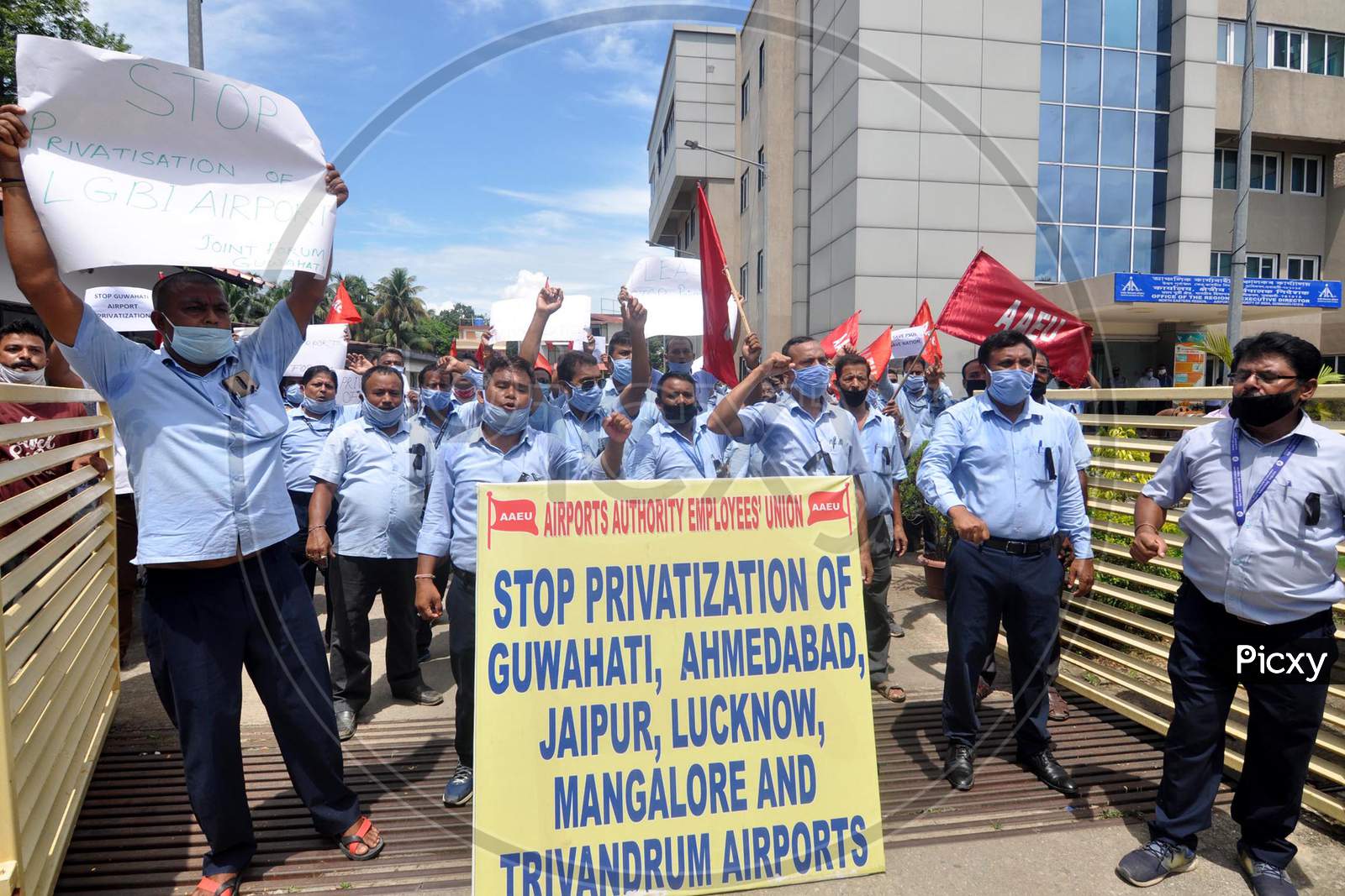 Members of Airports Authority Employees' Union (AAEU) stage a protest over Centre's approval to lease three airports, Jaipur, Guwahati and Thiruvananthapuram, under the public-private partnership (PPP) model, outside LGBI Airport in Guwahati, Monday, Aug. 24, 2020.