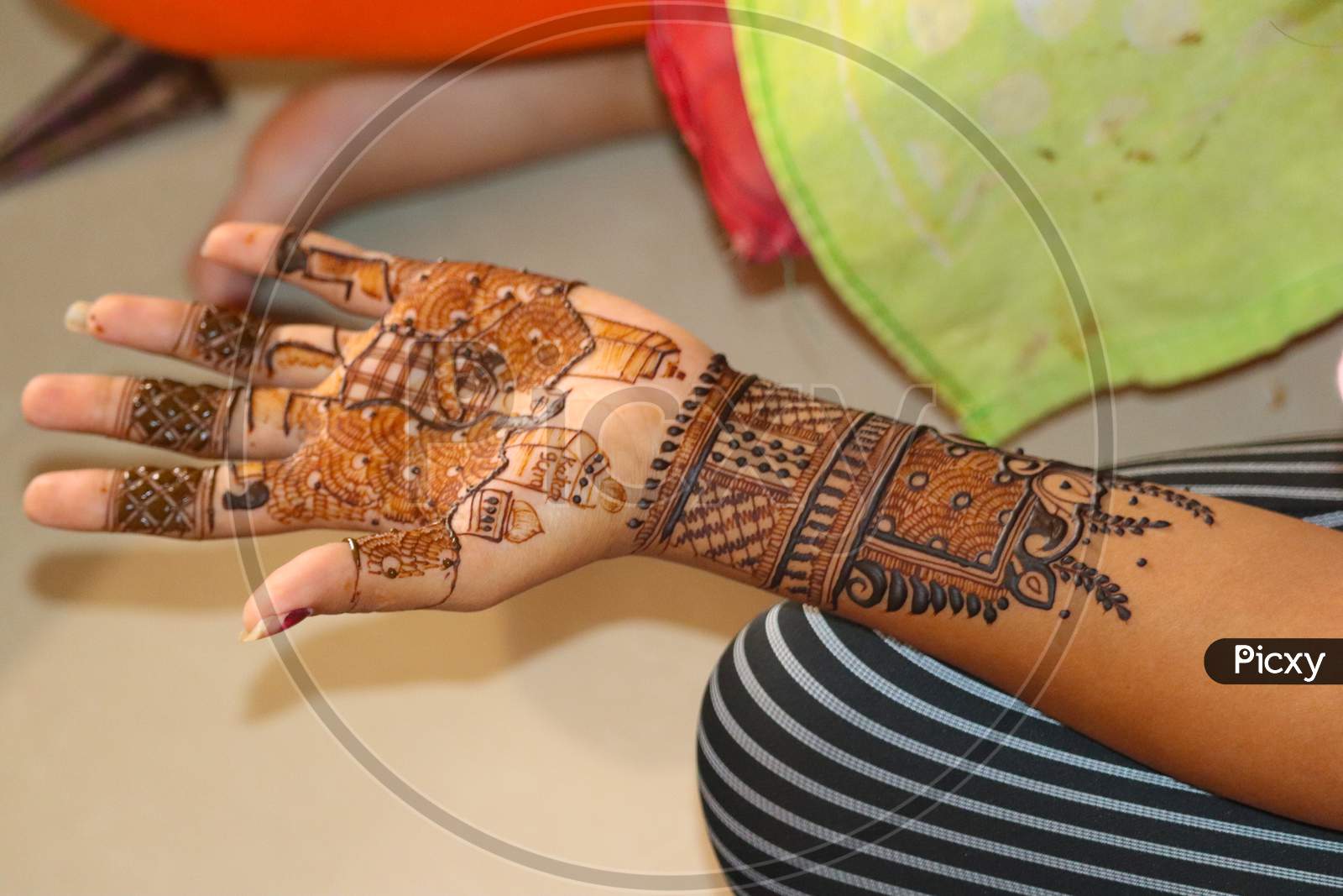 Indian Bride Showing Mehndi Tattoos Design