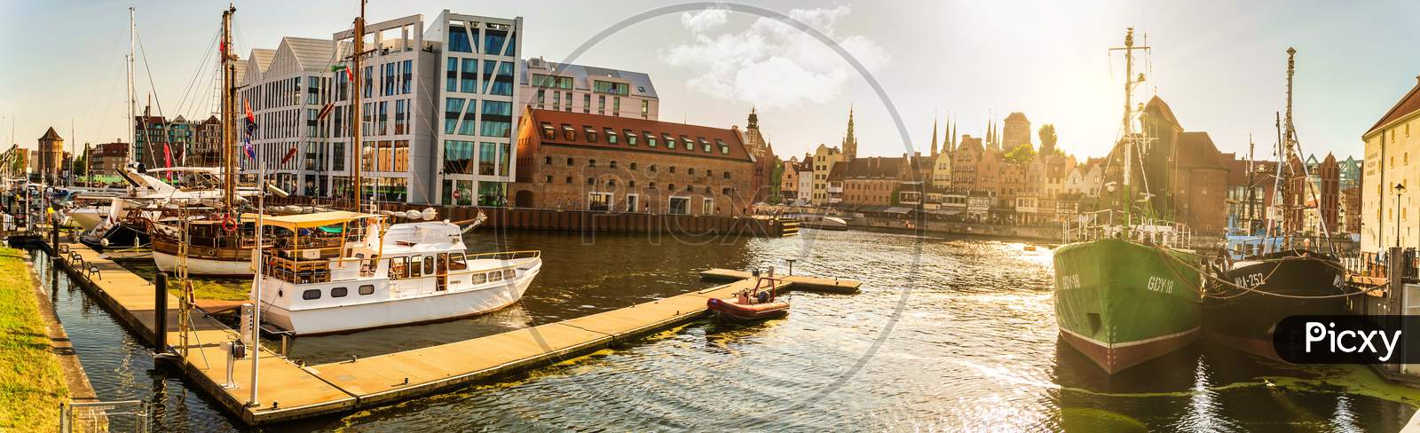 Gdansk, North Poland - August 13, 2020: Sunset Panoramic View Of Summer Around Motlawa River Adjacent To Beautiful Polish Architecture Near Baltic Sea And Boats Docked