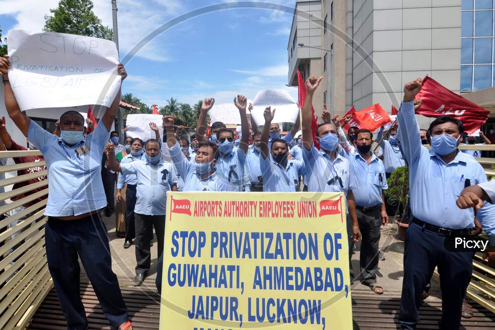 Members of Airports Authority Employees' Union (AAEU) stage a protest over Centre's approval to lease three airports, Jaipur, Guwahati and Thiruvananthapuram, under the public-private partnership (PPP) model, outside LGBI Airport in Guwahati, Monday, Aug. 24, 2020.