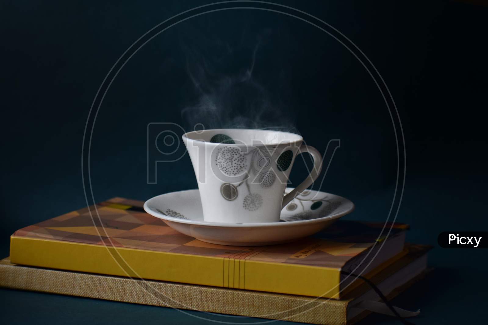 Steaming Coffee cup on diary
