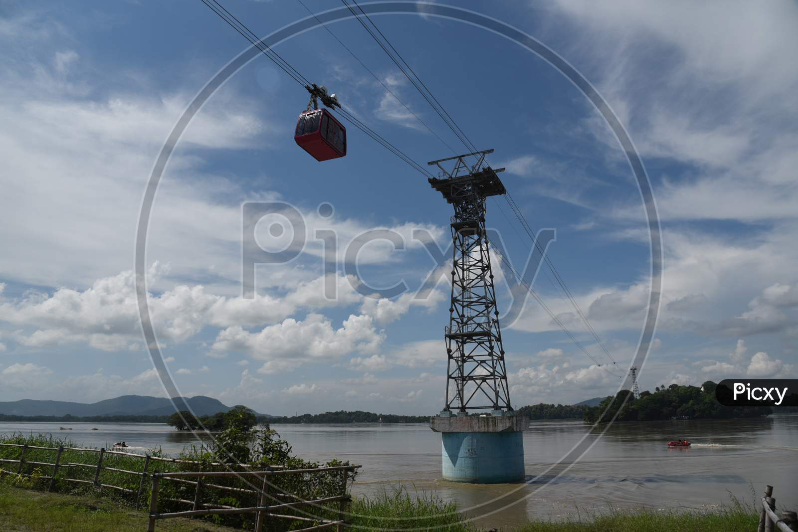 People Travel In Cable Car Cabins In India's Longest River Ropeway Over The River Brahmaputra, In Guwahati On August 24, 2020.