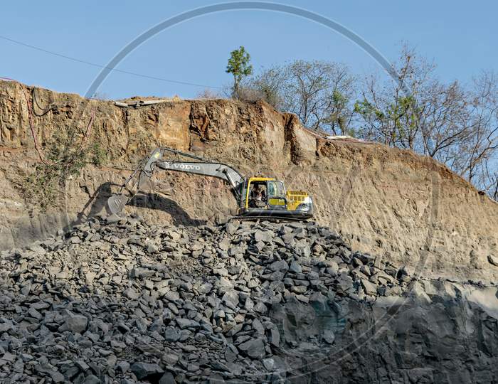 Excavator Of Volvo Company Digging For Road Widening.