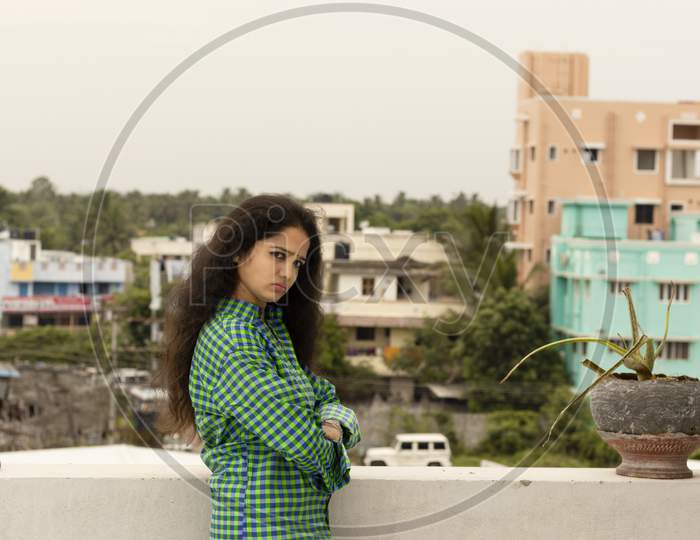 A Young Hindu Indian Woman Standing In An Open Environment Above The Roof Of The House And Happily Photographed Beautiful