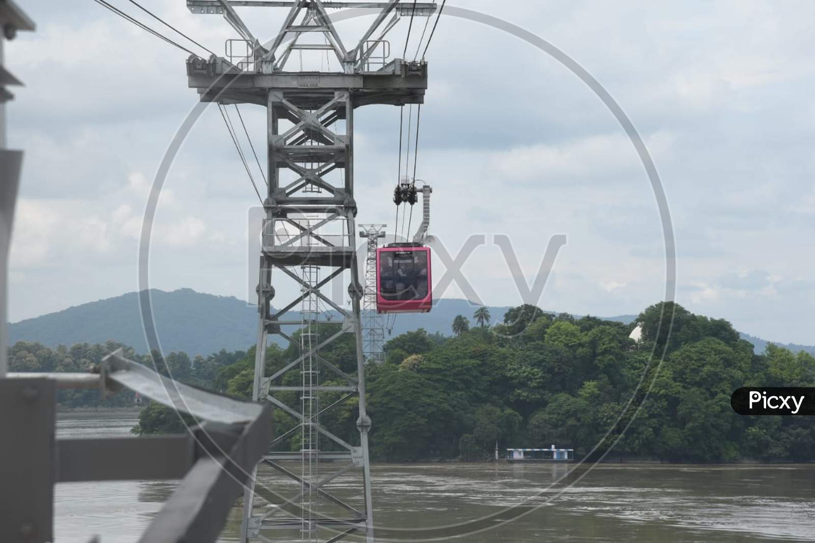 People Travel In Cable Car Cabins In India'S Longest River Ropeway Over The River Brahmaputra, In Guwahati On August 24, 2020.