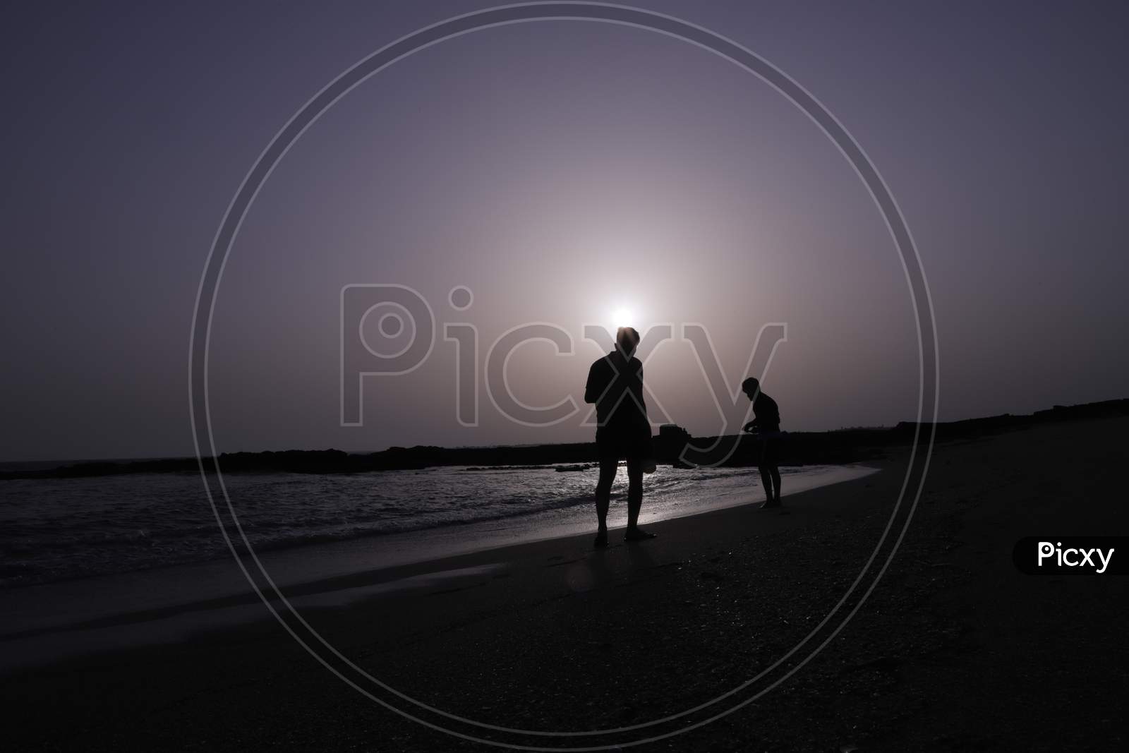Beautiful Beach View. Sand And Sea At Sunset & Sunrise Times With Copy Space. Beach Sunset - Sunrise With Waking Man On Beach Sand