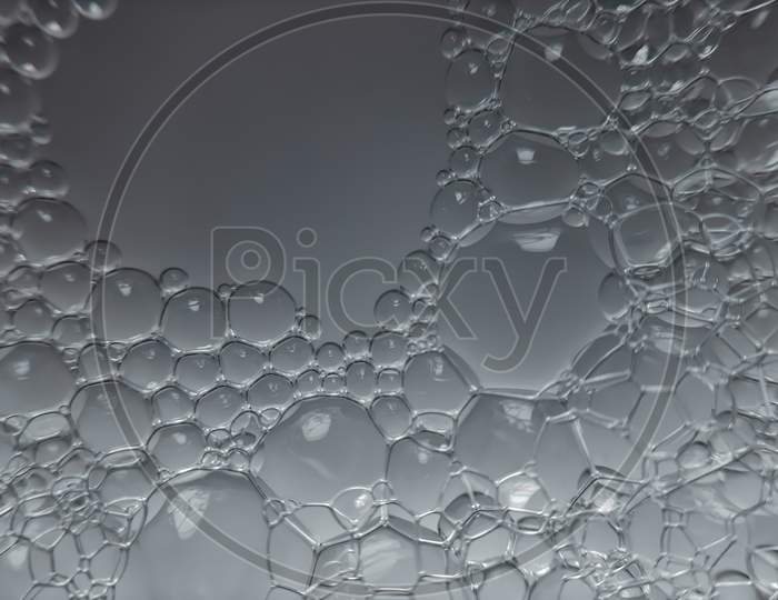 Macro photography of bubbles in soap water.