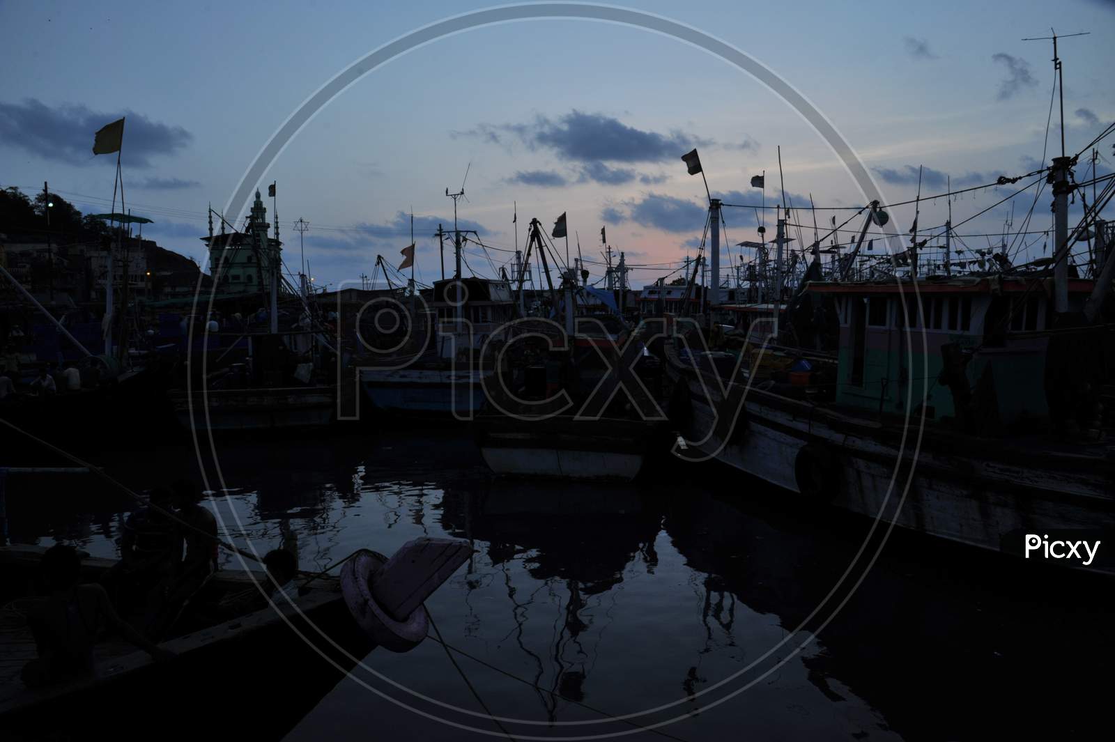 Fishing Boats Near Dock With Sunset Background