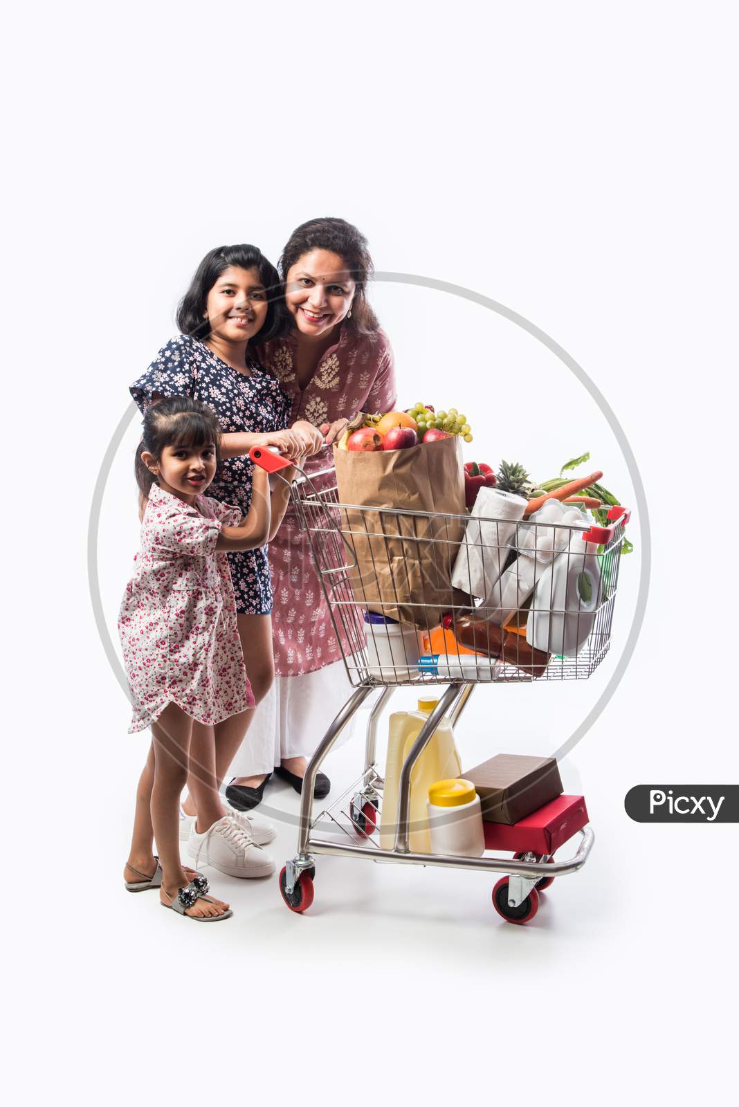 Indian Mom And Daughter Shopping With Trolly Or Cart