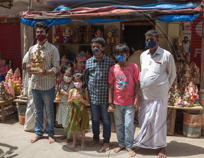 A Family purchasing a Ganesha idol for the festival at Mysuru/Karnataka/India.
