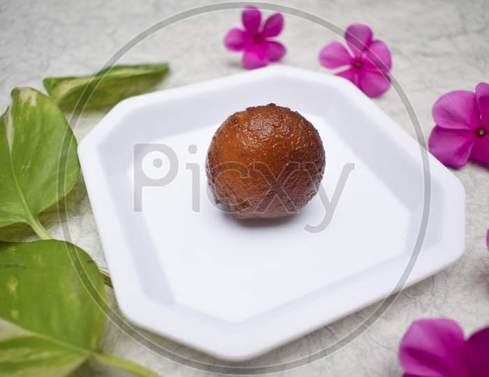Gulab Jamun A Dessert Often Eaten At Festivals, Celebrations In Indian Subcontinent. Single Piece Close Up Of A Sweet
