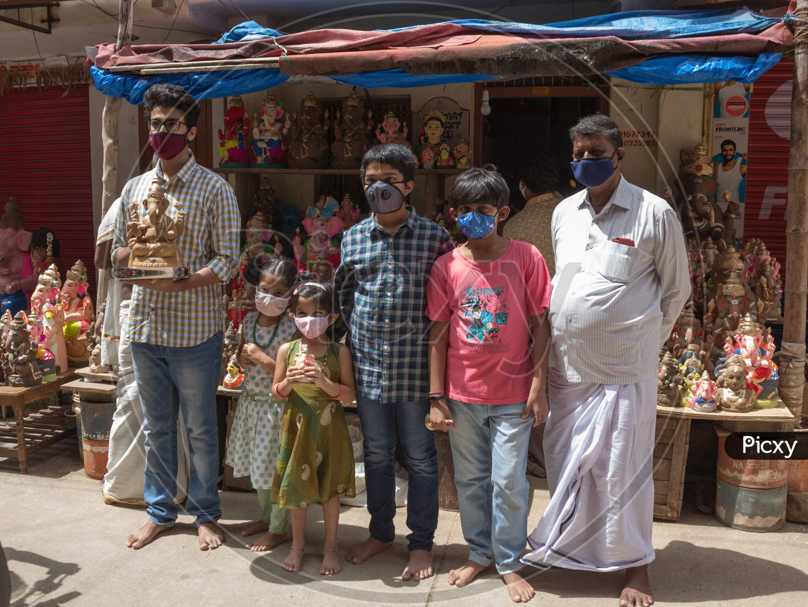 A Family purchasing a Ganesha idol for the festival at Mysuru/Karnataka/India.