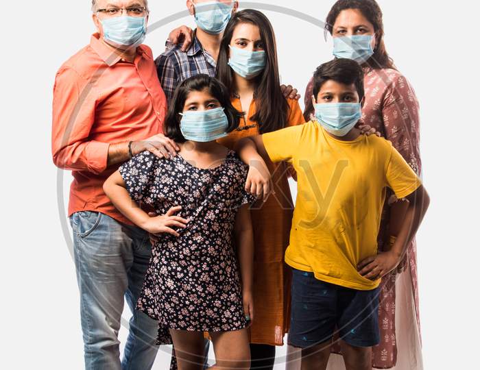 Indian Family Of Six In Group Wears Face Mask In Pandemic