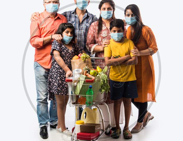 Indian Family Of Six In Group Wears Face Mask In Pandemic