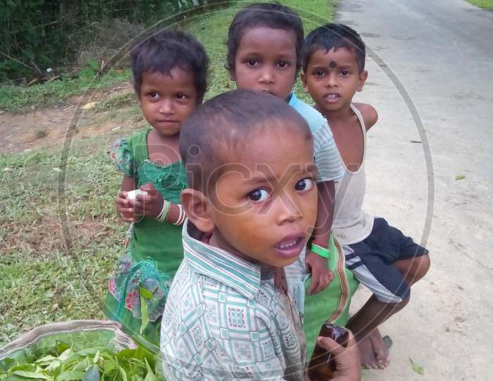 children playing in rural area,tea garden community