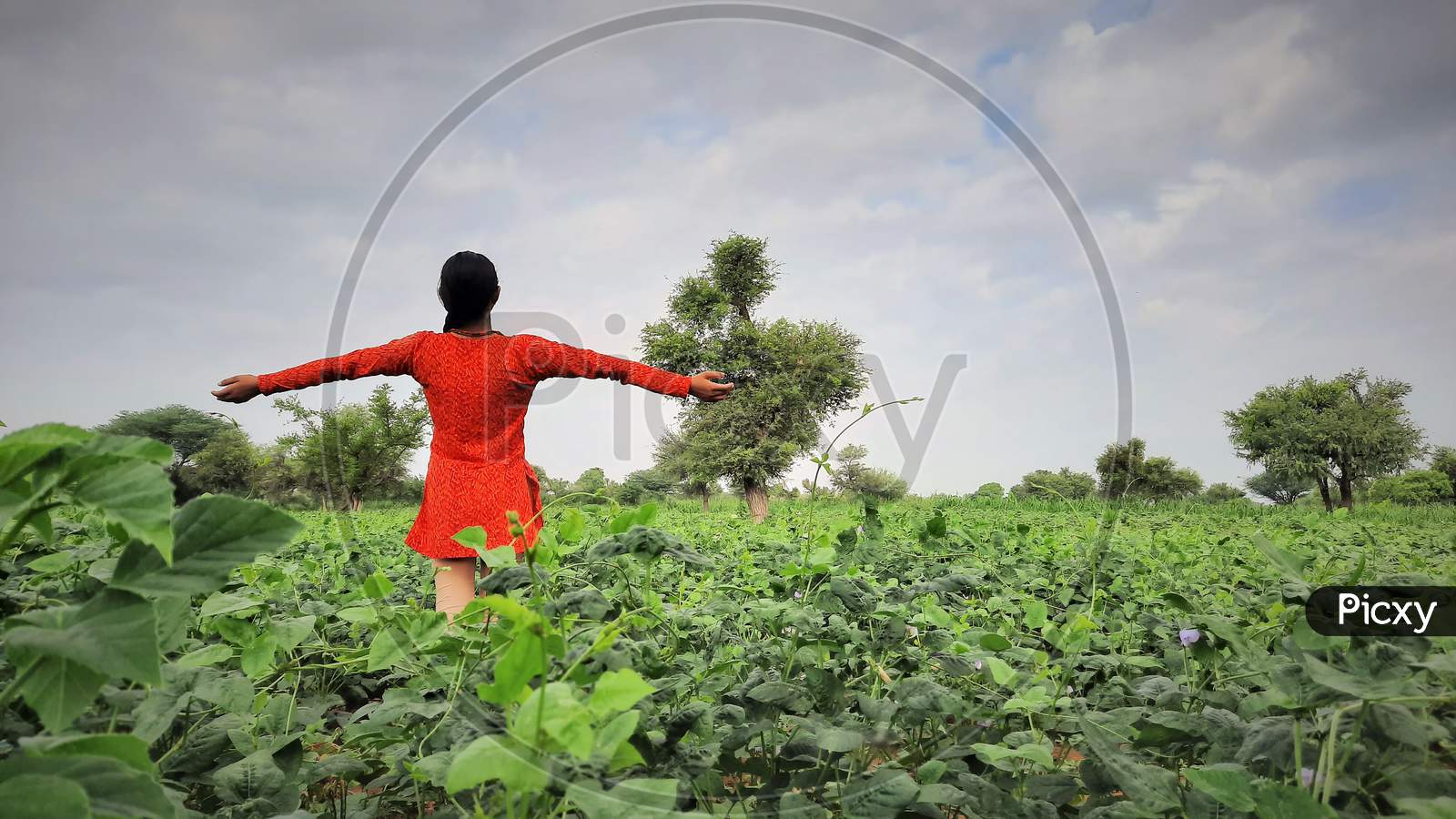 Asian Teenager Female Standing Wide Open Hands And Happy In Farms