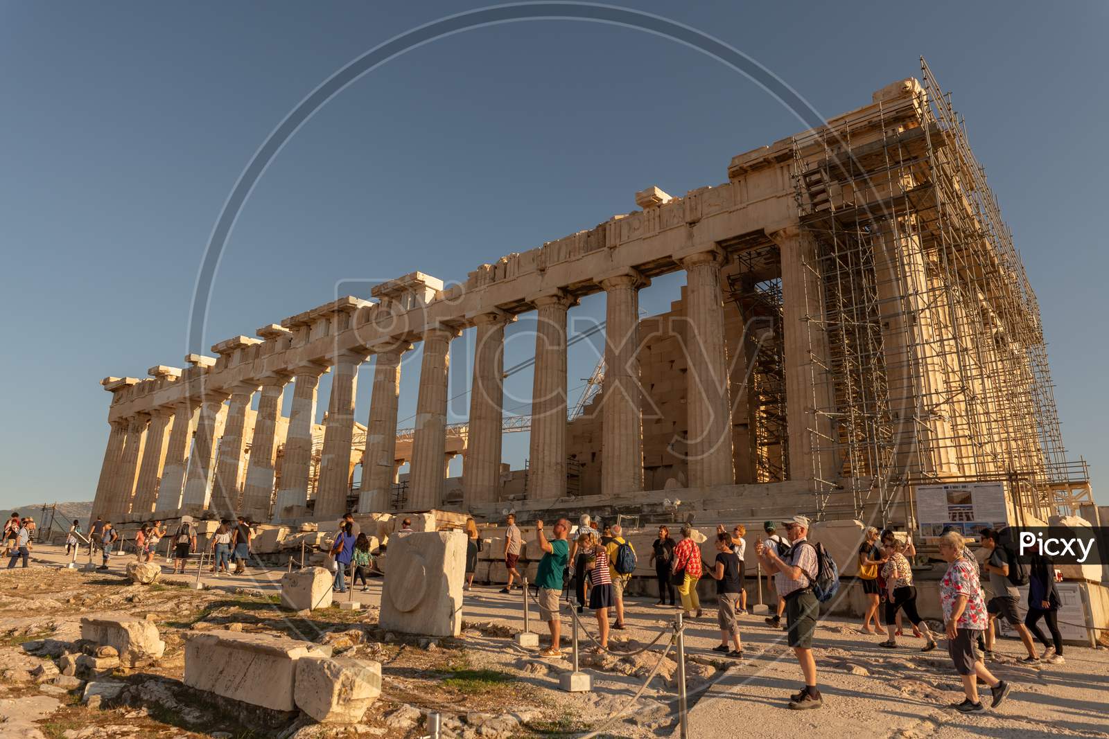 Athens, Greece - 13Th October, 2019: Tourists Admiring And Taking Pictures Of The Parthenon, While Walking Past It.