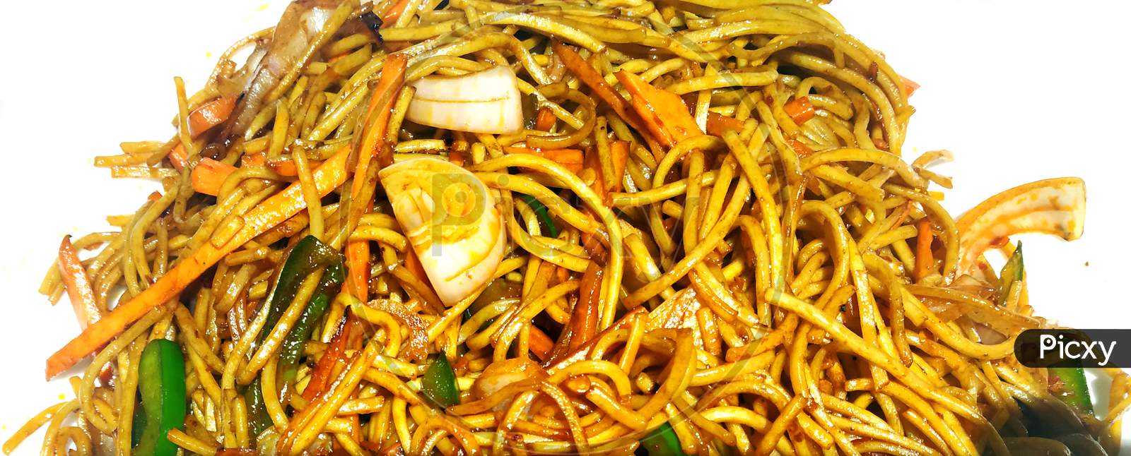 Schezwan Noodles Or Vegetable Hakka Noodles Or Chow Mein Is A Popular Indo-Chinese Recipes, Served In A Bowl Or Plate