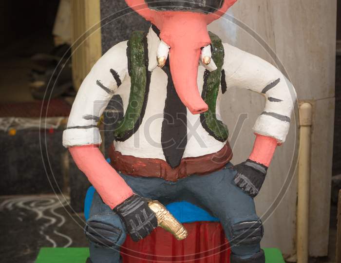 A Clay model of Ganesha designed as a Western Cowboy at Mysuru/Karnataka/India.