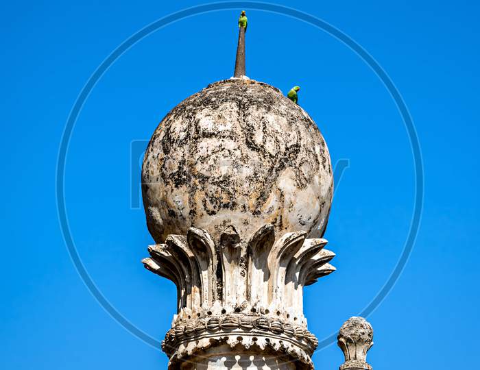Parrots Sitting On The Side Pillars Of Golghumbaj-The Mausoleum Of King Mohammed Adil Shah, Sultan Of Bijapur.