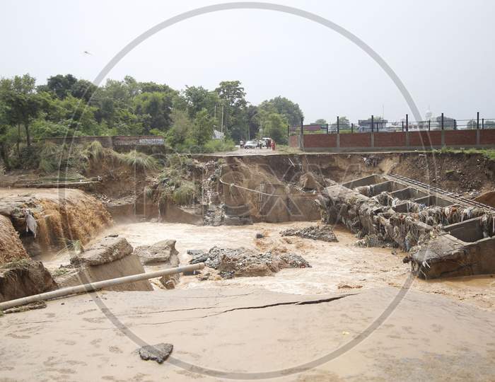 Destroyed bridge over a stream after a heavy rain in the outskirts of Jammu,  26 August 2020.