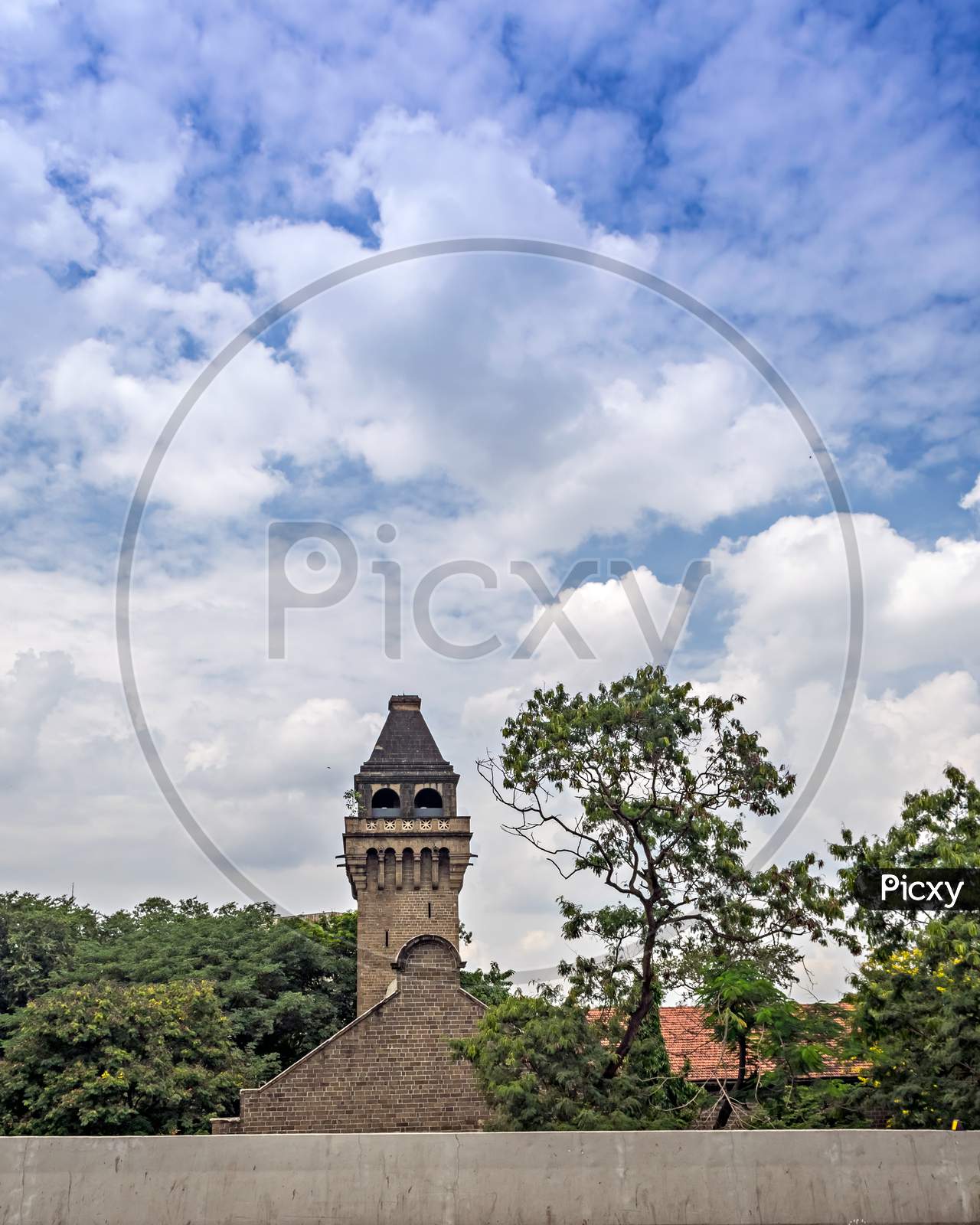 Nice Clouds And Blue Sky Over Ancient Dome Of College Of Engineering Pune.