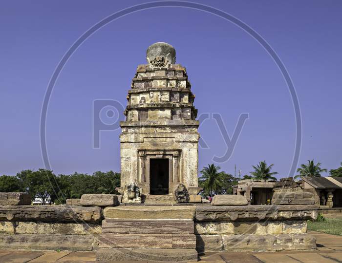 Ancient Natural Stone Temple With Clear Blue Sky Background In Aihole, India.