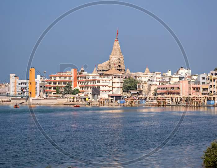 Gomathi Ghat And View Of Dwarkadheesh Temple, Gujrat, India With Clear Blue Sky.