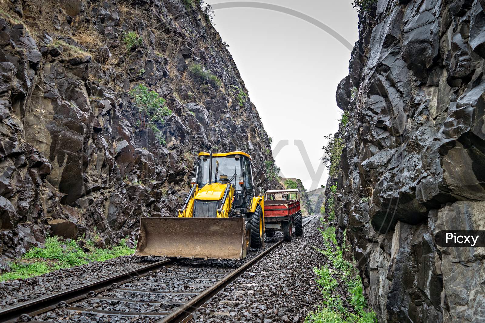 Equipment For Removing Vulnerable Rocks On The Side Of Railway Track.