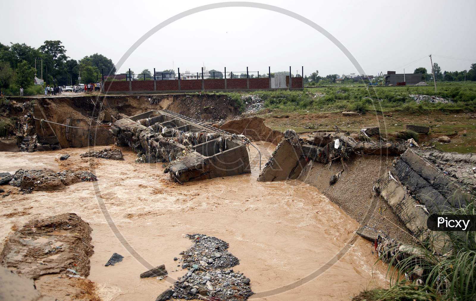 Destroyed bridge over a stream after a heavy rain in the outskirts of Jammu,  26 August 2020.