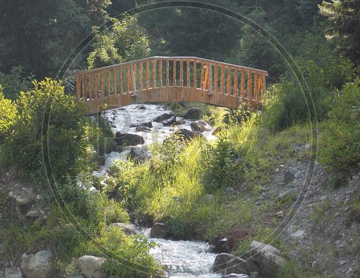 A Beautiful Wooden Bridge on a Rivulet In Kashmir