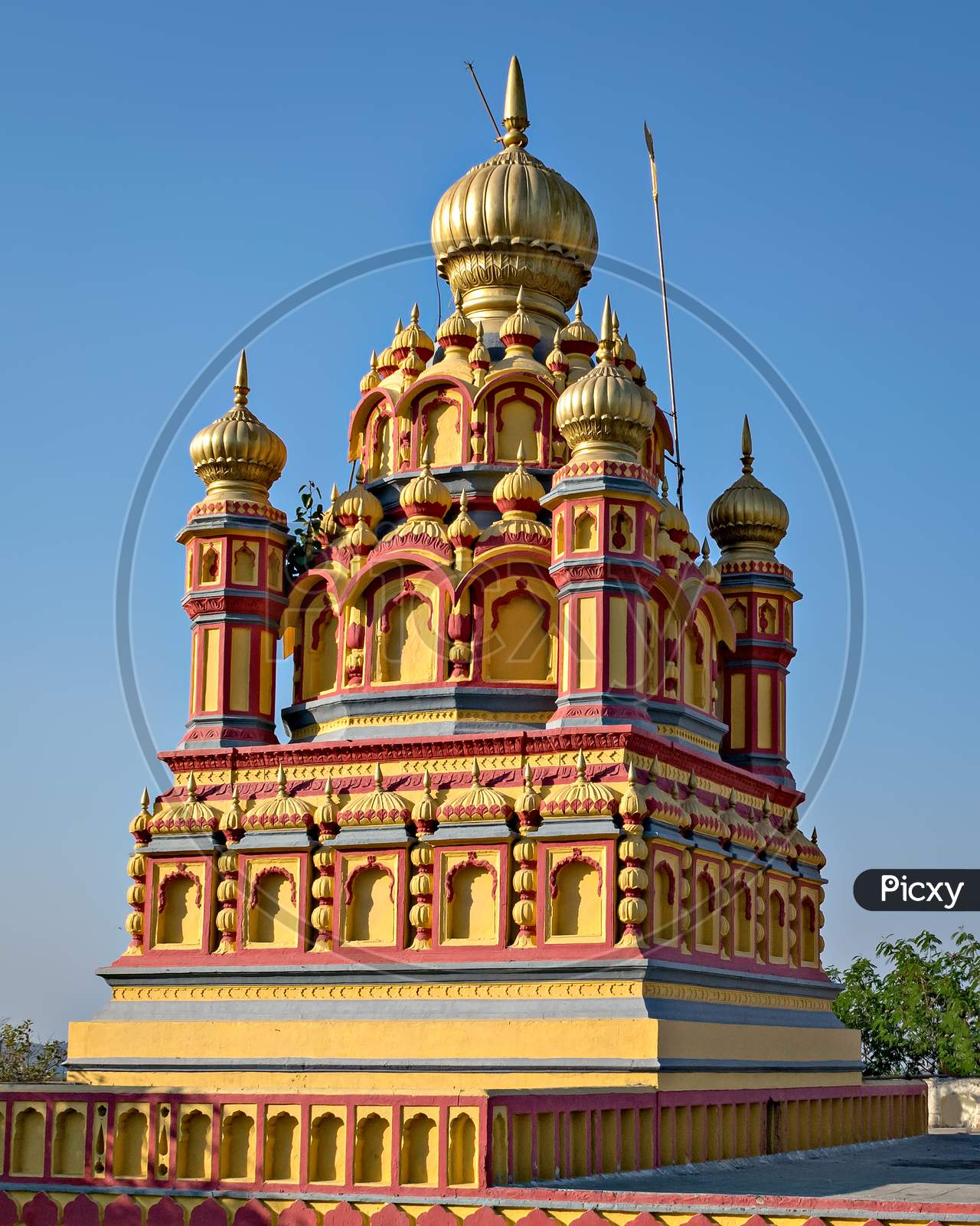 Dome Of Oldest Heritage Structure In Pune-Parvati Temple With Blue Sky Background.