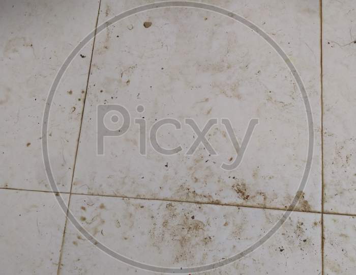 Dirty Kitchen Tiles On The Floor.