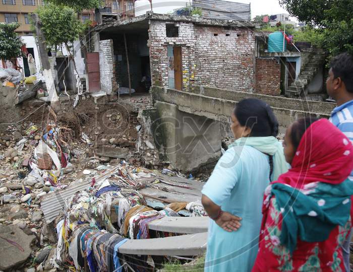 House damaged due to heavy rainfall, at Kalka colony in Jammu,  Aug. 26, 2020.