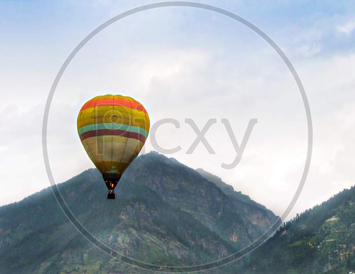 Isolated Image Of Hot Air Balloon High In The Air At Manali, India.