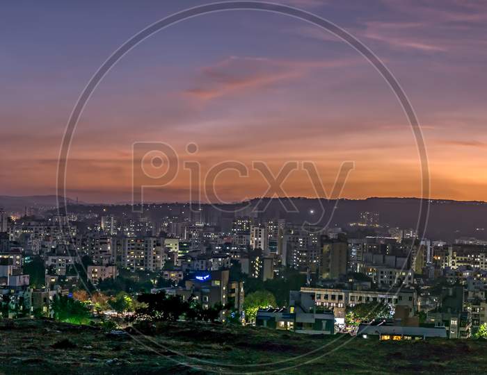 Panorama Image Of Beautiful Evening Sky In The City With Some Lights In Buildings. Can Be Used As Background.