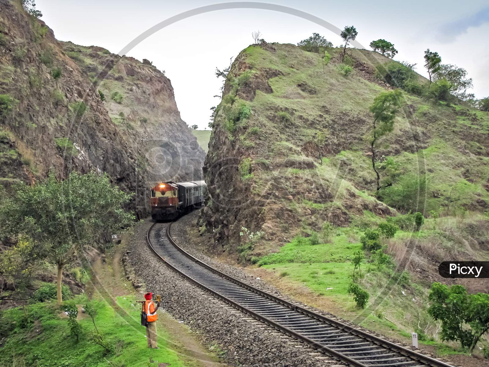 Passenger Train Through Cutting In Shindawane, Maharashtra, India.