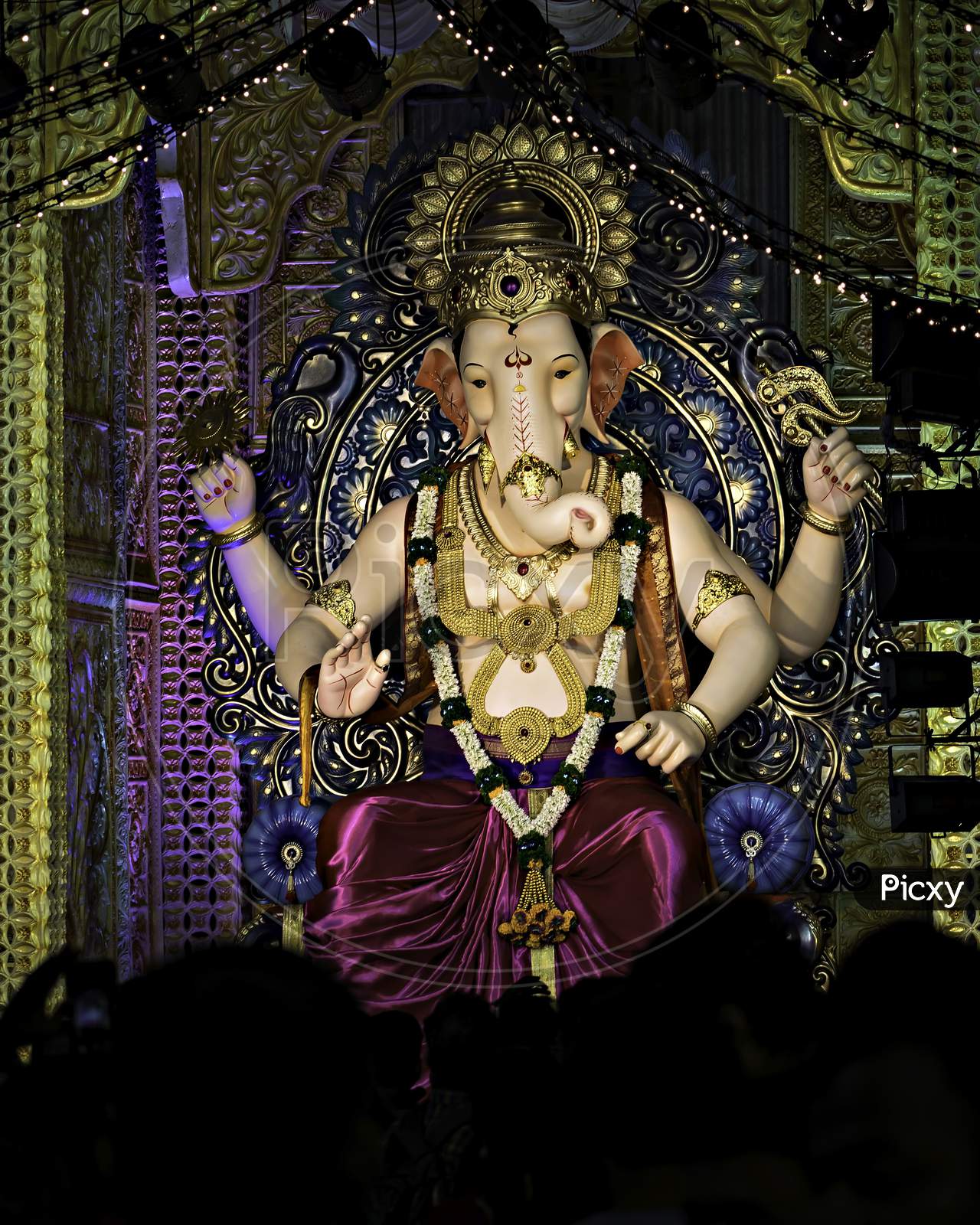 Closeup, Portrait View Of Decorated And Garlanded Idol Of Hindu God Ganesha.