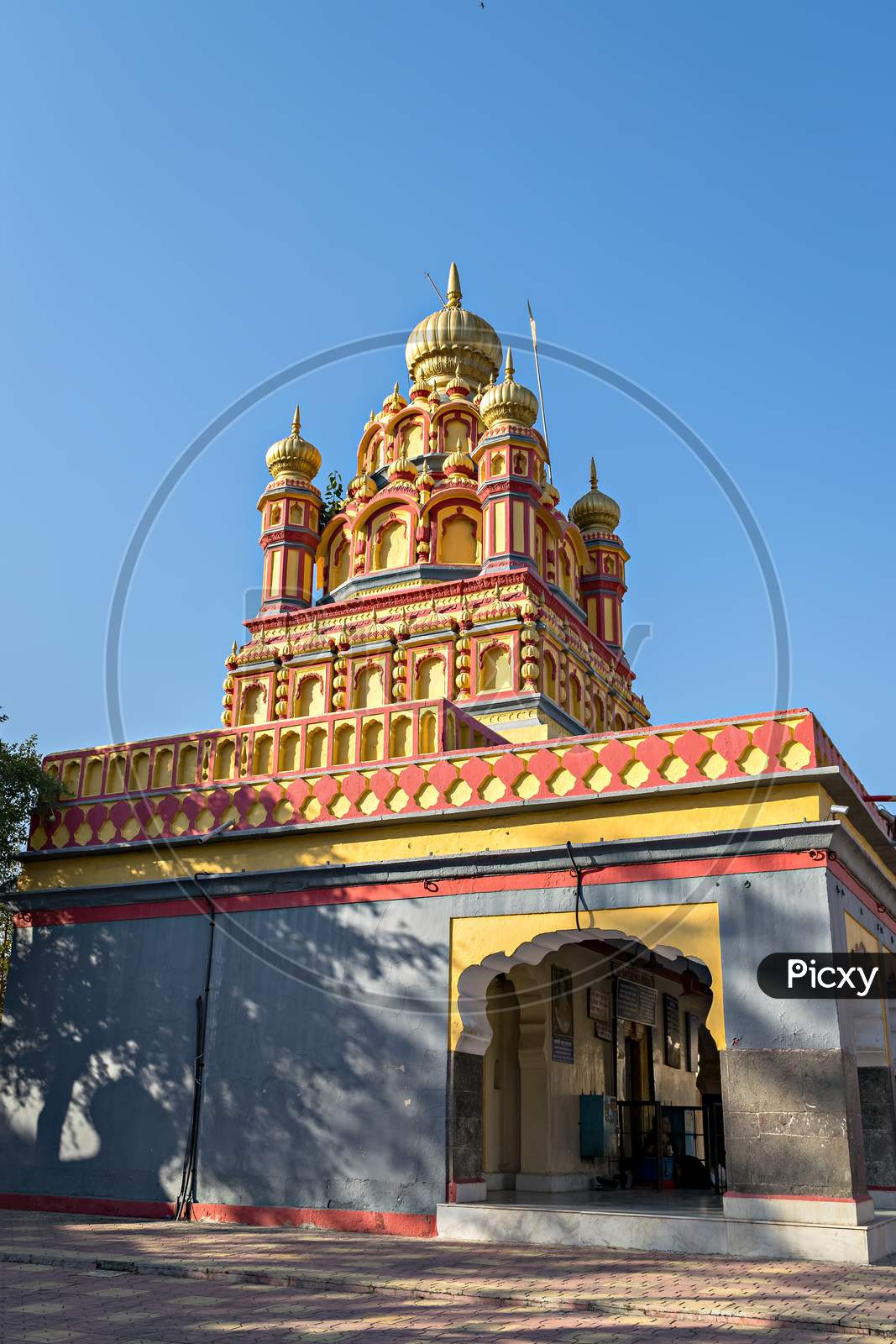 Oldest Heritage Structure In Pune-Parvati Temple On A Clear Blue Sky Background.