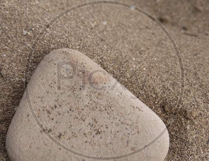 Stone near sea shore closeup photo