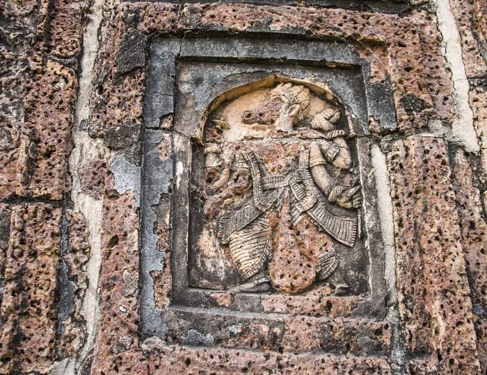 The terracotta work in a wall of a temple.