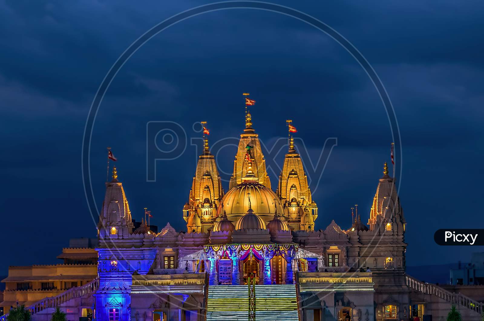 Lighted Image Of Shree Swaminarayan Temple With Monsoon Clouds Background, Pune .