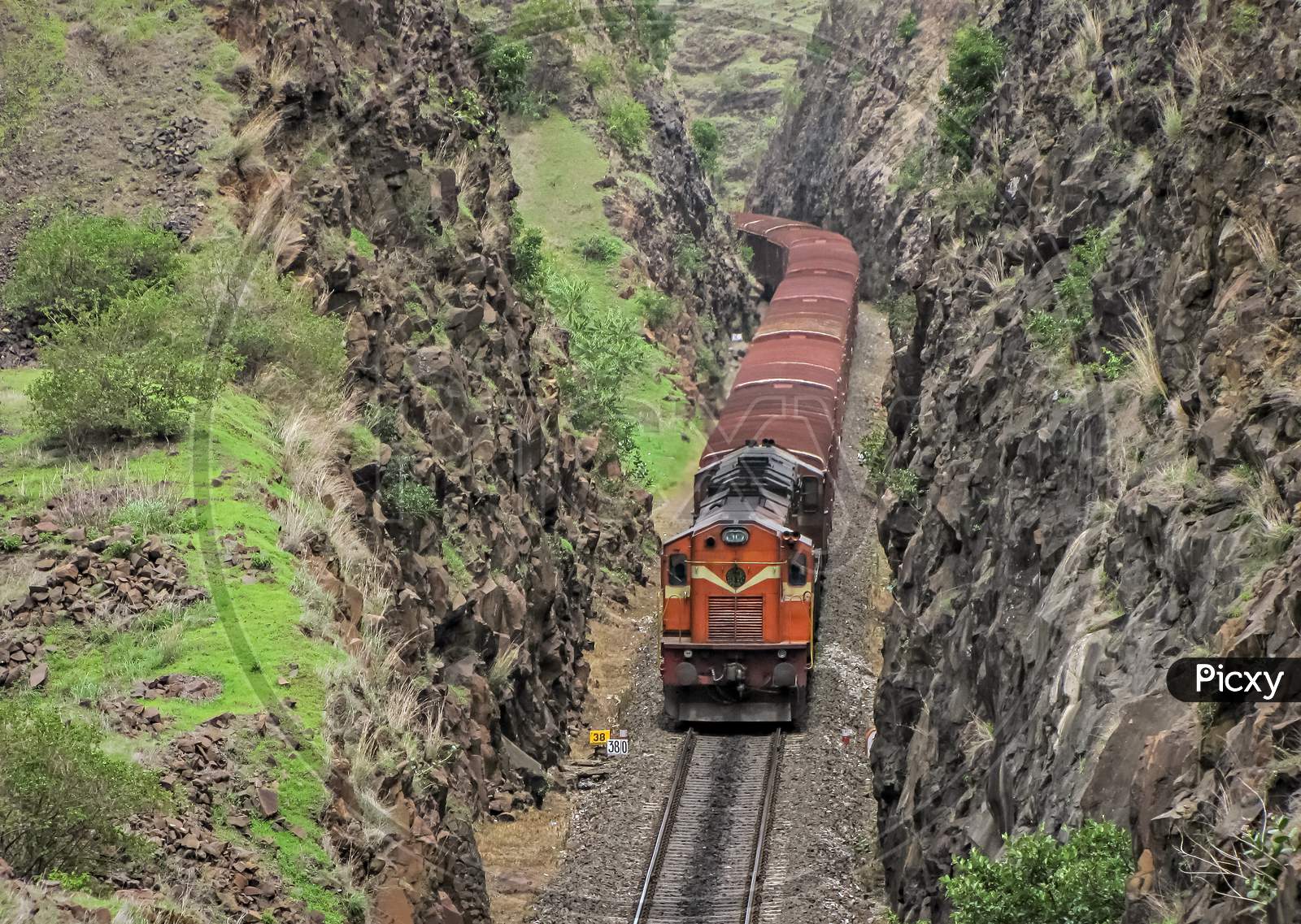 Goods Train Through Cutting In Shindawane, Maharashtra, India.